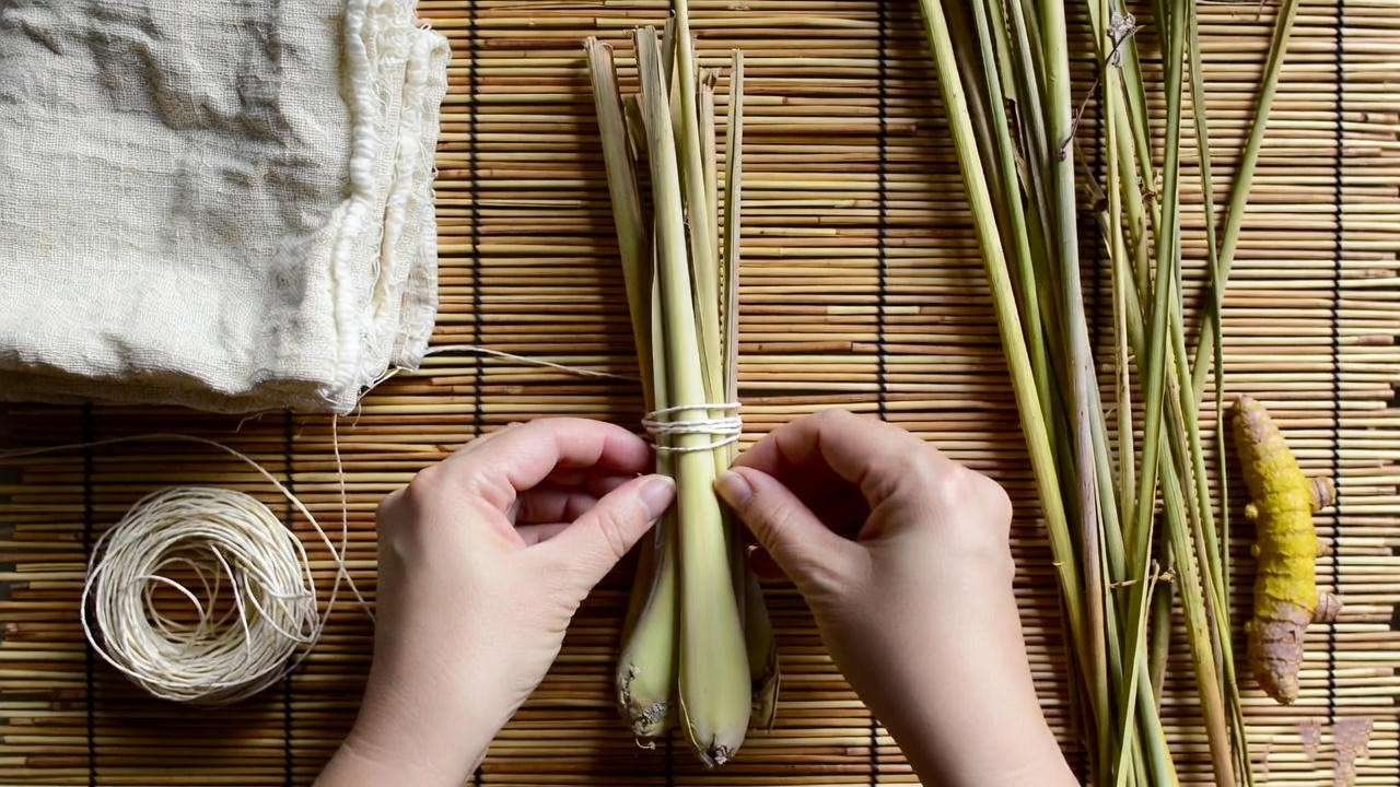 DIY Thai herbal compress ball ingredients and assembly on bamboo mat